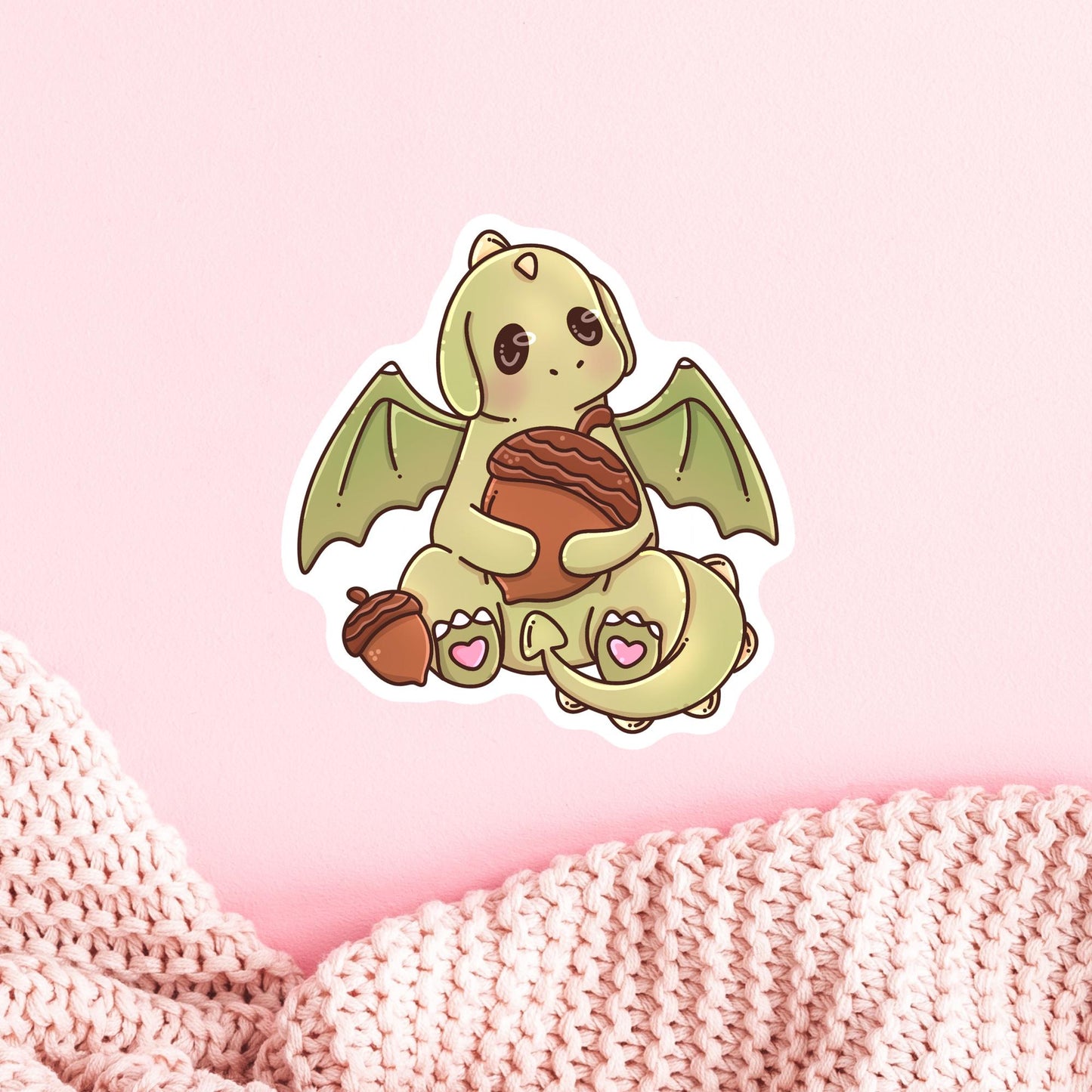 Green Dragon autumn sticker on a laptop, cute fantasy die-cut sticker for book lovers who enjoy cozy reading season
