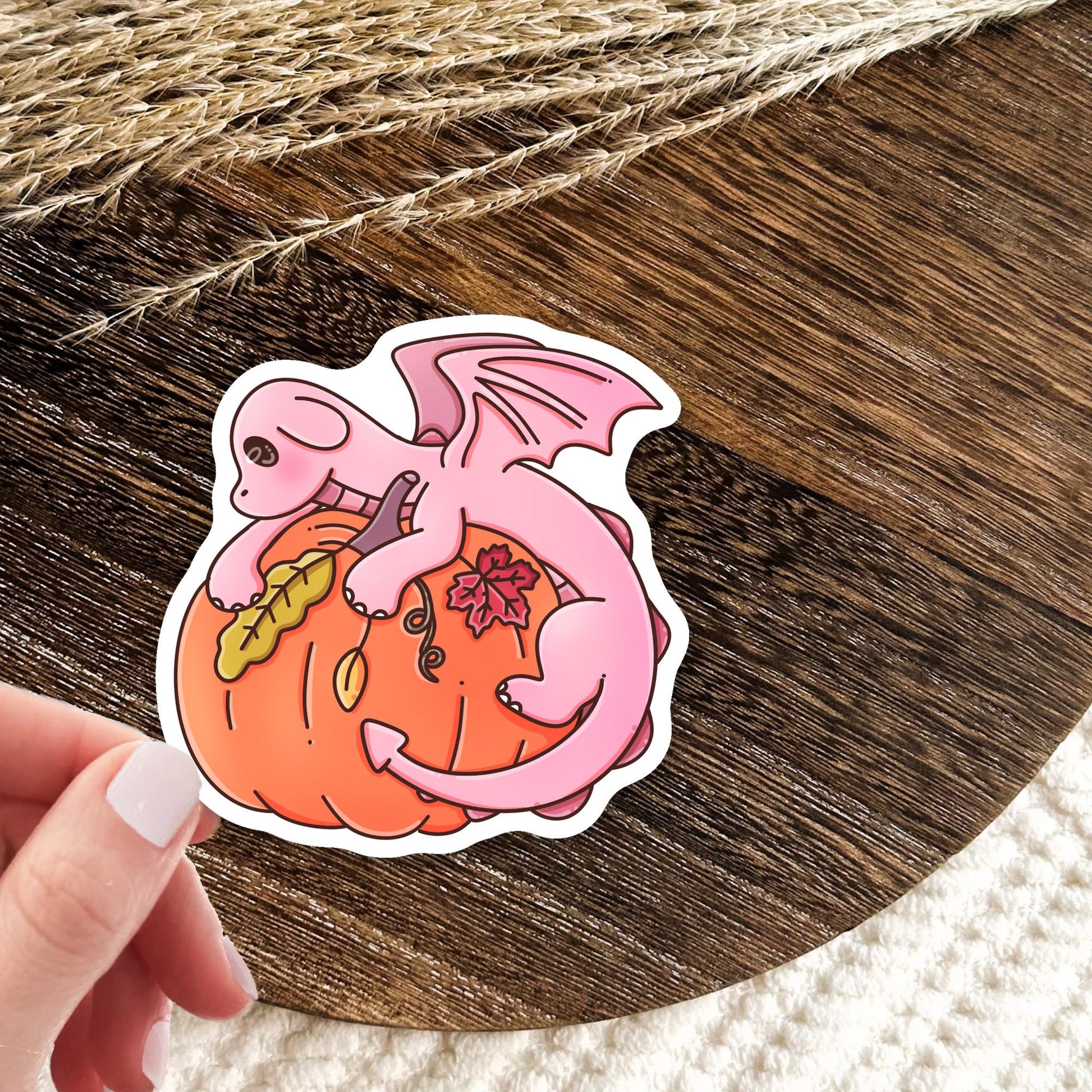 Autumn pink dragon book lover sticker lifestyle photo, cozy fall die-cut waterproof sticker for Kindle and planner decoration