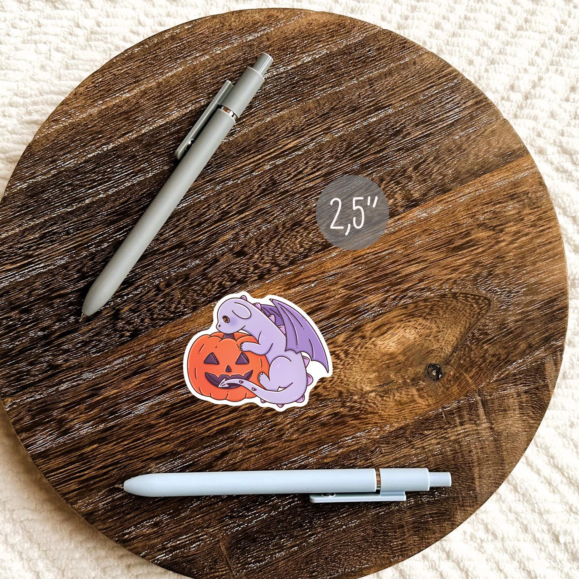 Halloween purple dragon vinyl sticker on a journal, cute spooky die-cut sticker for witch aesthetic fantasy book lovers