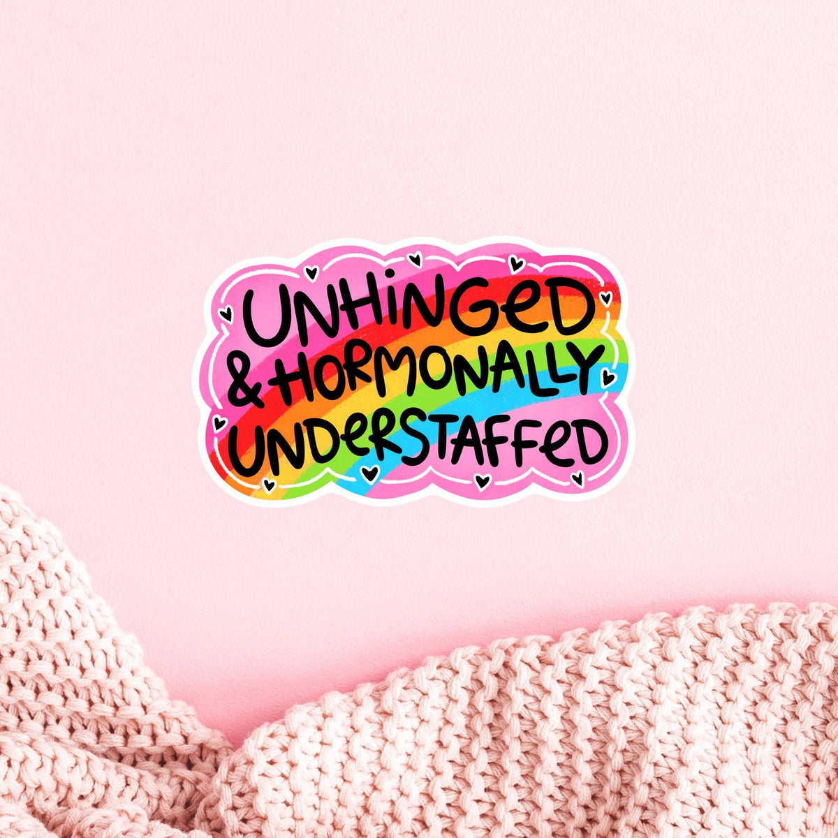 Rainbow Unhinged Understaffed vinyl sticker on a pink planner page, cute aesthetic snarky quote decal for journals and stationery lovers