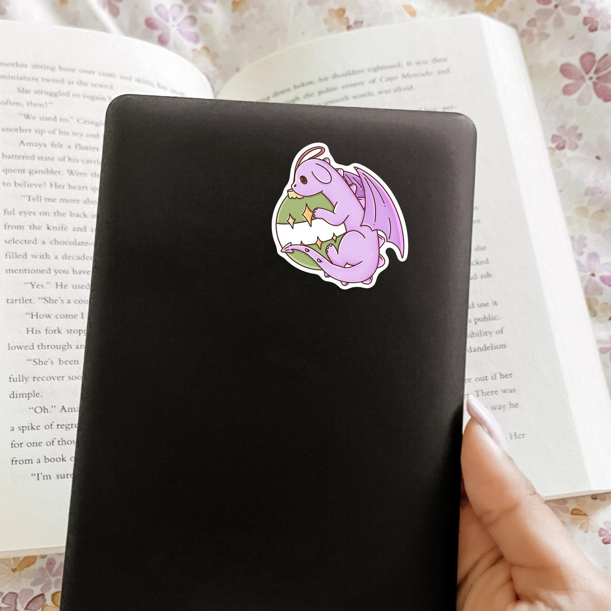 Ornament Dragon vinyl sticker on a black e-reader or phone case, cute fantasy Christmas decal gift for Kindle and phone case decoration