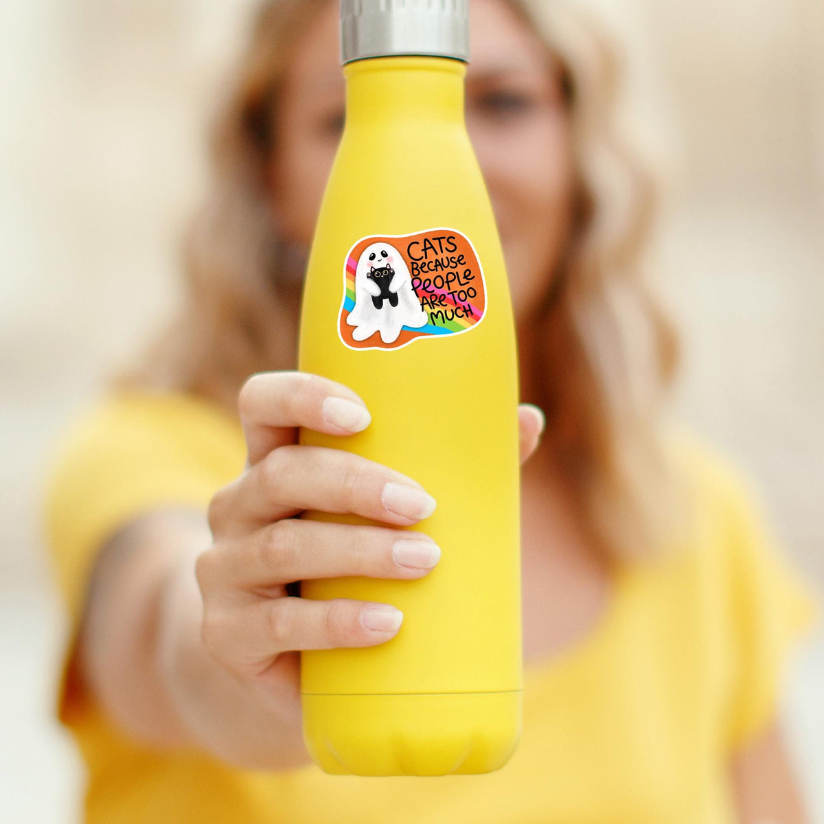 Cats Because People Are Too Much sticker on a yellow water bottle, durable waterproof vinyl decal for tumblers and cat moms