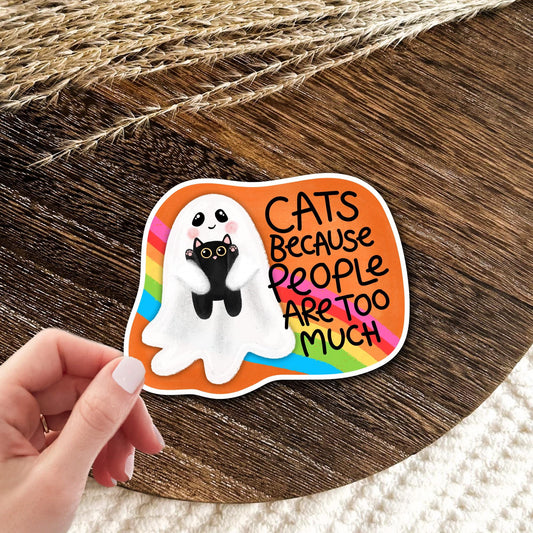 Cats Because People Are Too Much ghost cat vinyl die-cut sticker held in hand on wood, funny introvert humor gift for cat lovers