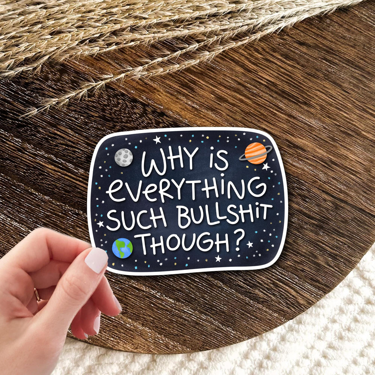 Why Is Everything Like This galaxy chalkboard vinyl die-cut sticker held in hand on wood, funny sarcastic existential humor gift