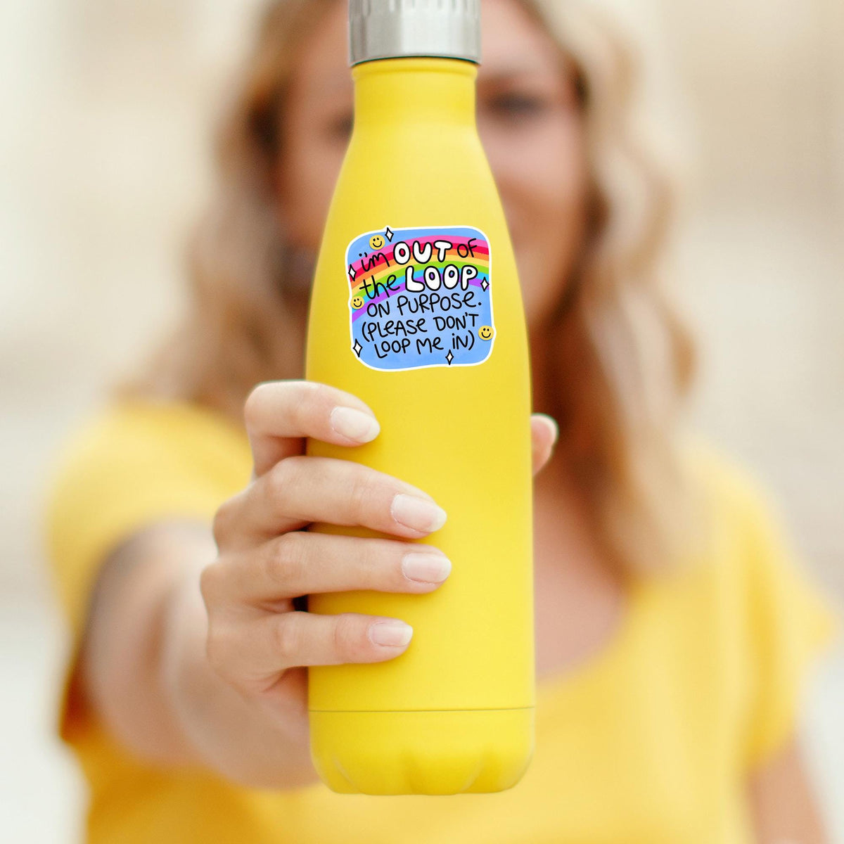 I'm Out Of The Loop On Purpose sticker on a yellow water bottle, durable waterproof vinyl decal for tumblers and best friend gifts