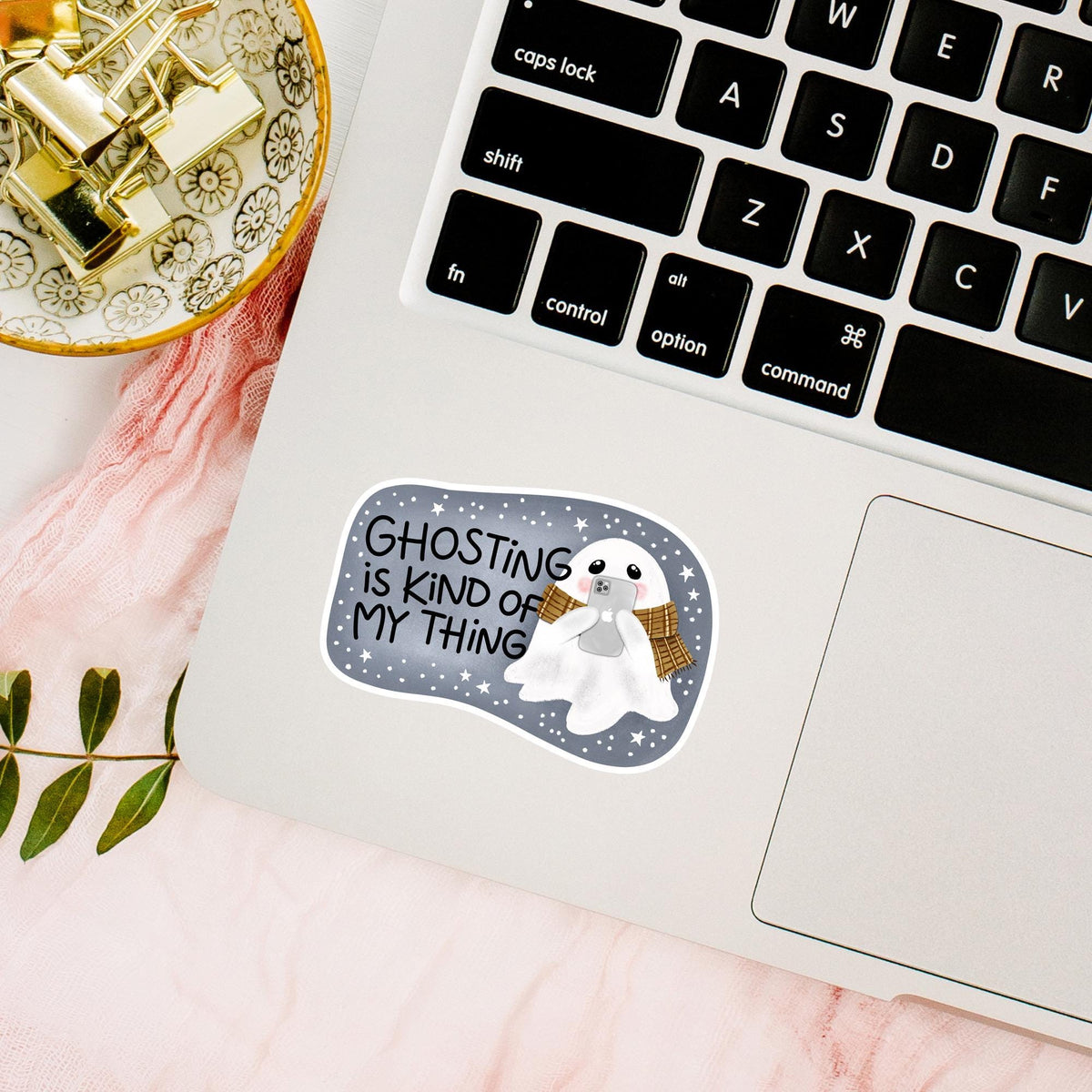 Ghosting Is Kind Of My Thing die-cut vinyl sticker on a laptop next to the keyboard, waterproof sarcastic decal for laptop lovers