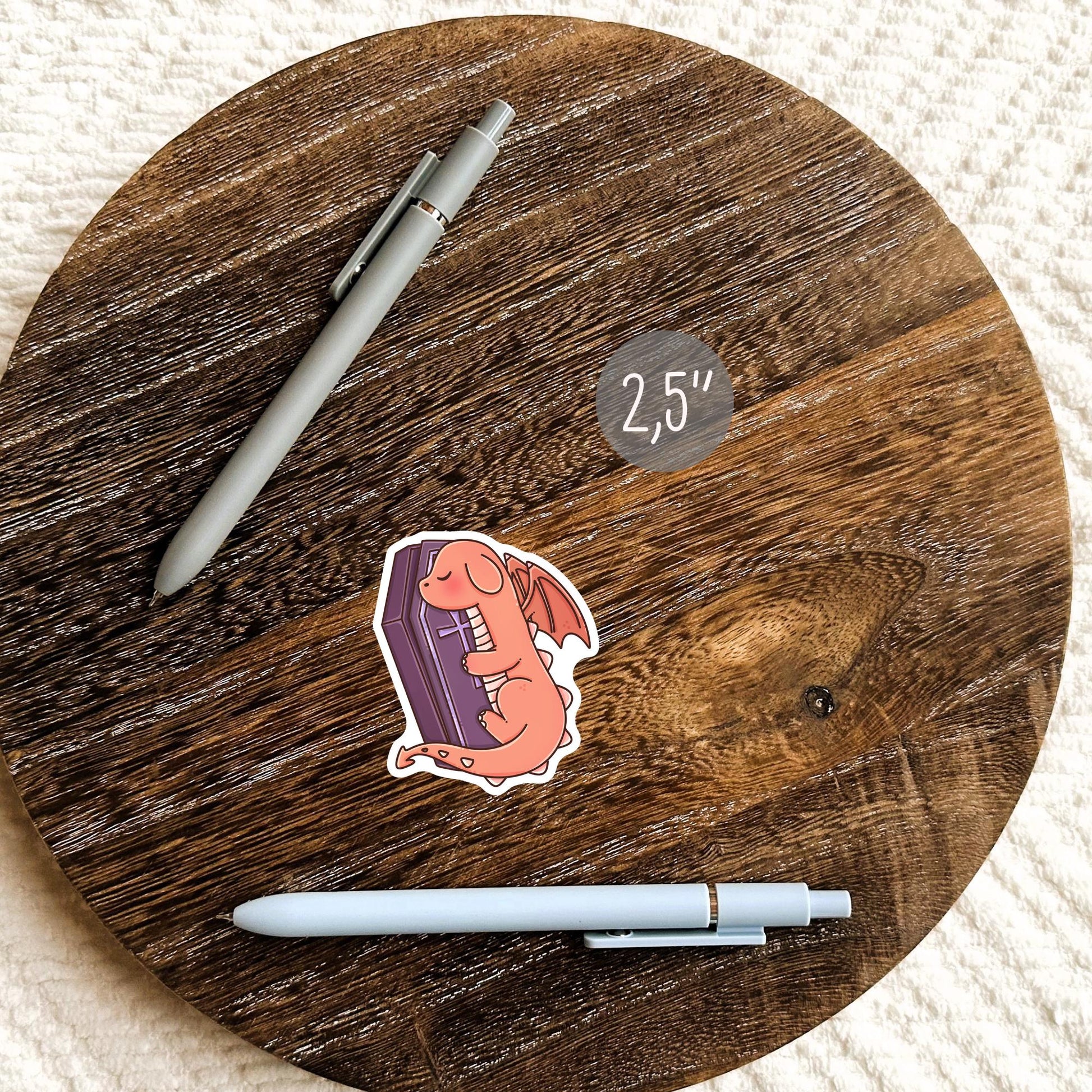 Halloween Orange Dragon sticker lifestyle mockup - cute spooky dragon gift for book lovers
