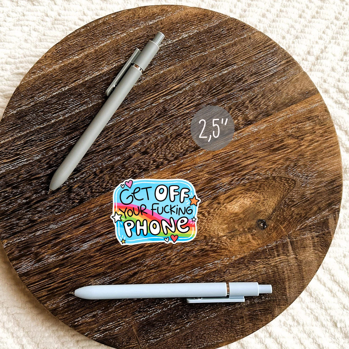 Get Off Your Phone die-cut sticker on a wooden planner, colorful aesthetic decal for journals and desk decor