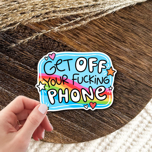 Get Off Your Phone rainbow vinyl die-cut sticker held in hand on wood, funny sarcastic screen time humor gift