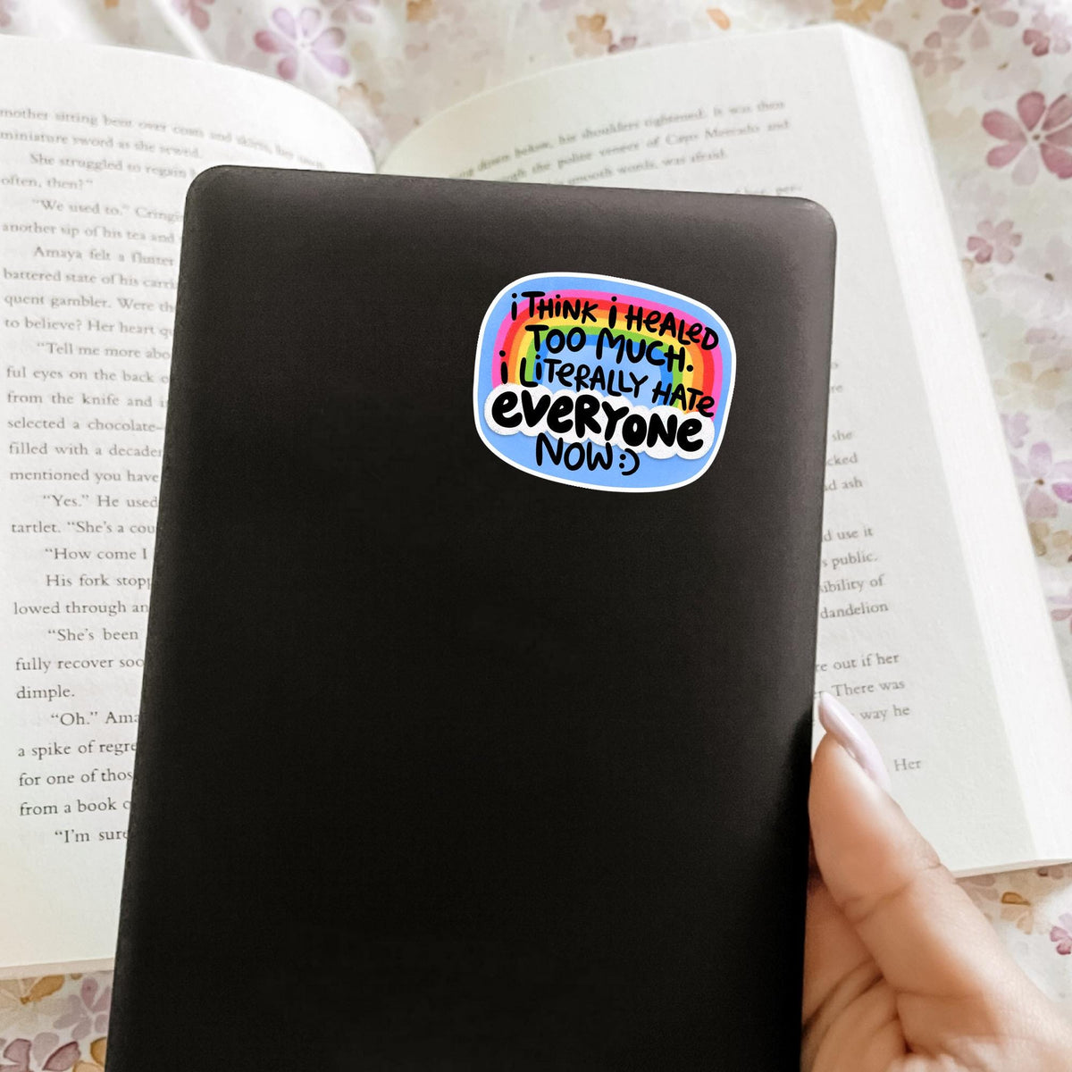 Healed Too Much sticker on a black notebook cover, matte vinyl snarky quote decal, relatable gag gift idea for journaling and desk decor