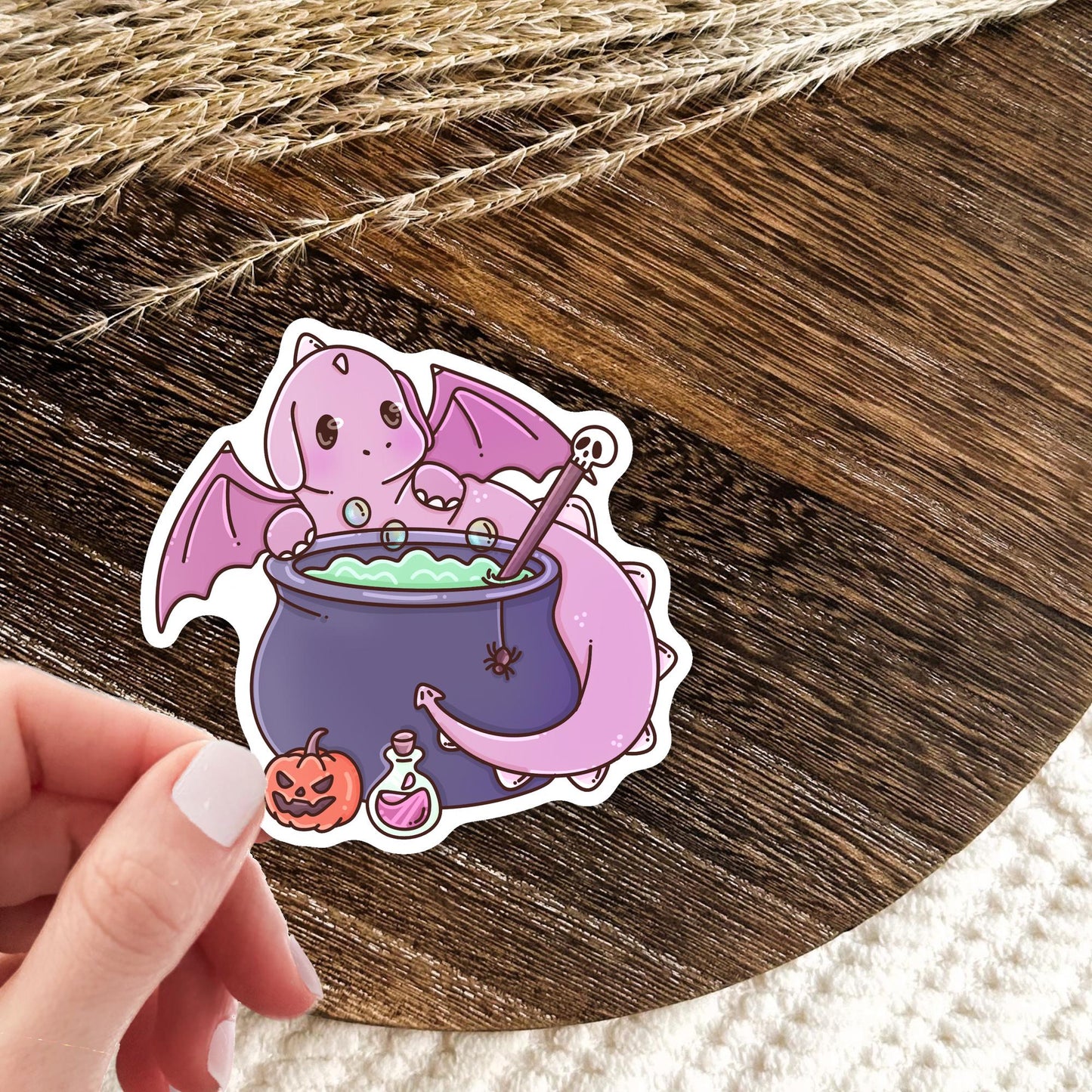 Halloween Pink Dragon sticker mockup, cute spooky pink vinyl die-cut sticker for dragon lovers and book readers