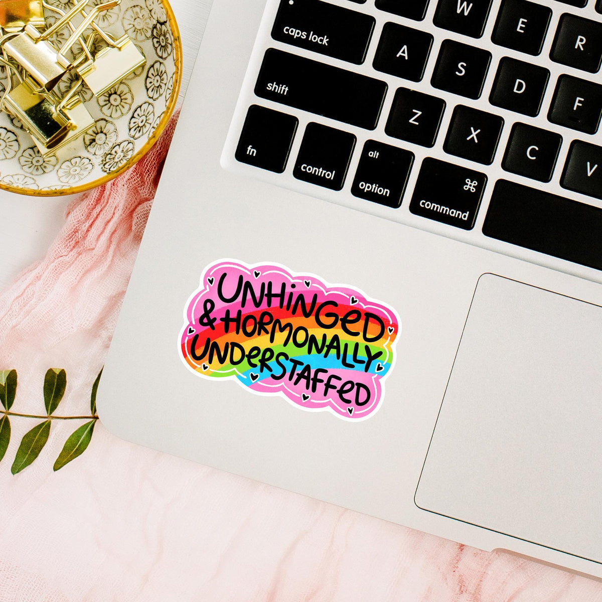 Unhinged Hormonally Understaffed sticker on a laptop lid, waterproof vinyl decal, funny relatable mom life quote gift for desk decor